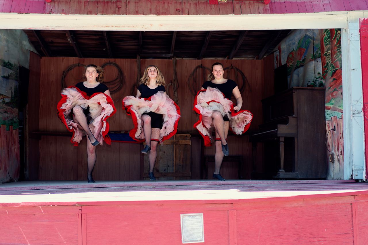 Wild West City owner Katherine “Katie” Benson, performing the Can Can dance alongside Juliet DiBonaventura and Samantha Schuman. Each actor plays multiple roles throughout the day.