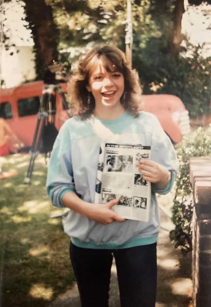 The author appears on the set of "Harry and the Hendersons" in 1986. "I am holding a teen magazine featuring my work in a previous film," she writes.