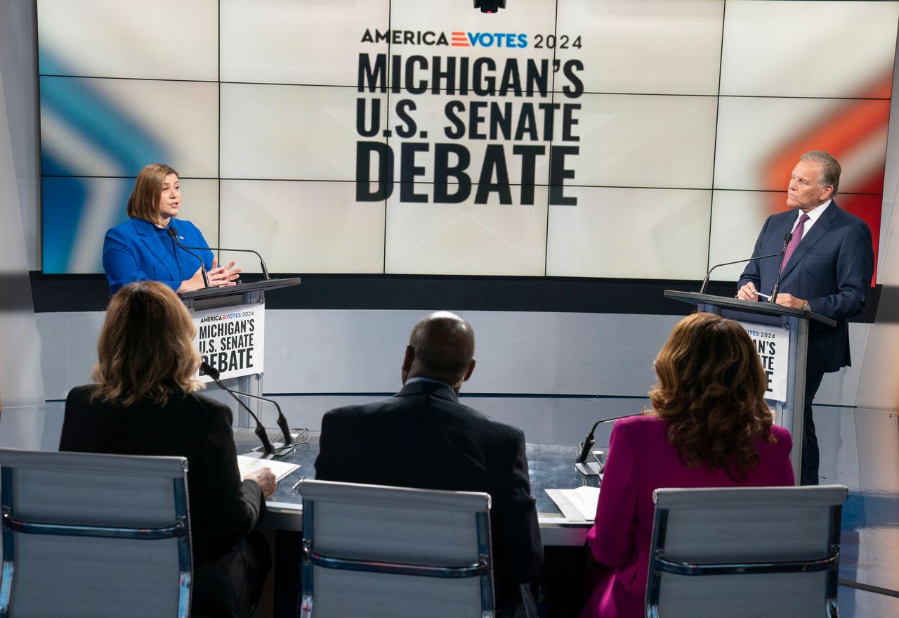 U.S. Rep. Elissa Slotkin, D-Holly, the Democratic candidate for the open Michigan U.S. Senate seat, left, and former U.S. Rep. Mike Rogers the Republican candidate vying for the seat, debate the issues Monday, Oct. 14, 2024, with moderators Alicia Smith, Chuck Stokes and Carolyn Clifford of WXYZ-TV in Southfield, Mich.