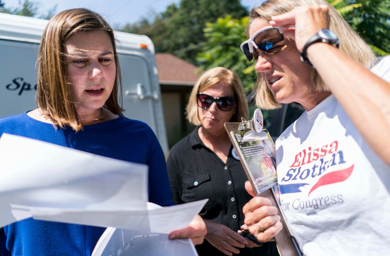 Slotkin canvasses door to door with campaign volunteers Karen More, center, and Laura Murphy, right, near Holly, Michigan on Friday August 31, 2018. This was her first campaign for the U.S. House, and she would go on to win the seat.